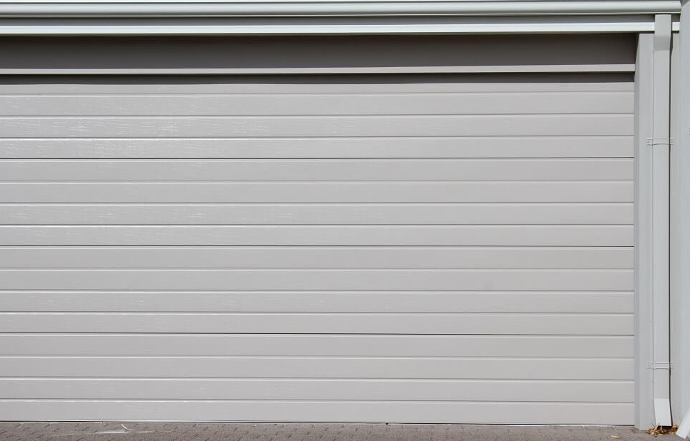 What is the difference between sectional and one piece garage door